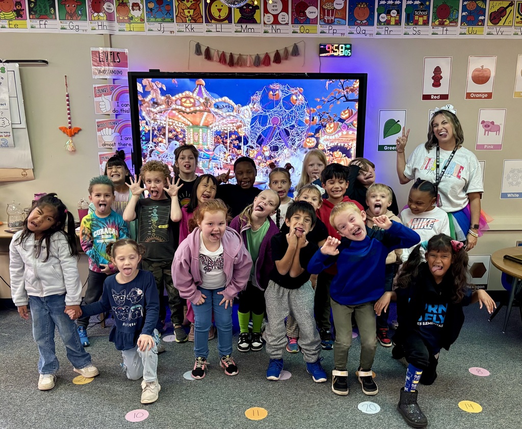 Image of students and staff dressed with crazy clothes and hair.