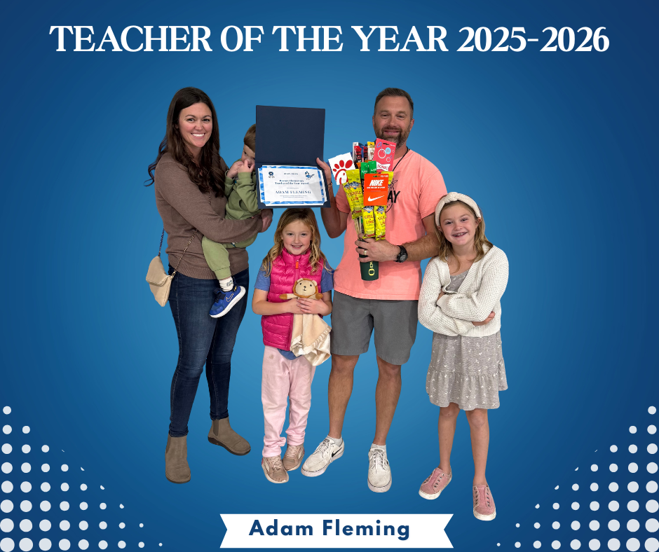 Image of Mr. Fleming with his family and Teacher of the Year award.