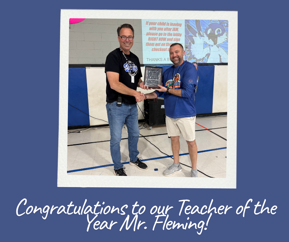 Image of Mr. Fleming receiving his Teacher of the Year plaque from Mr. Becker.