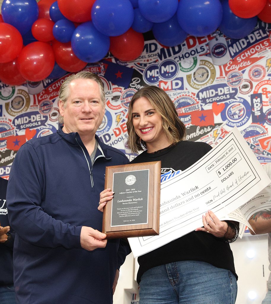 Picture of Mrs. Warlick receiving Adjunct Teacher of the Year Award from Mr. Cobb.