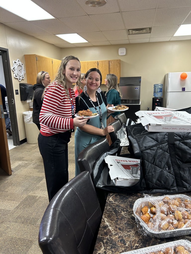 Image of teachers getting pizza from Joey's Pizzeria.