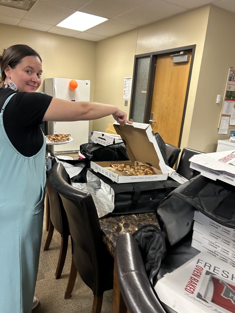 Image of Mrs. Green getting pizza from Joey's Pizzeria.