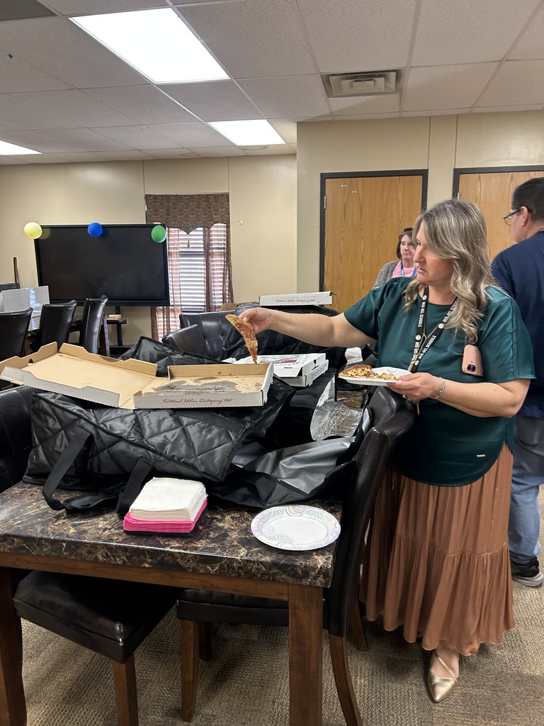 Image of teachers getting pizza from Joey's Pizzeria.