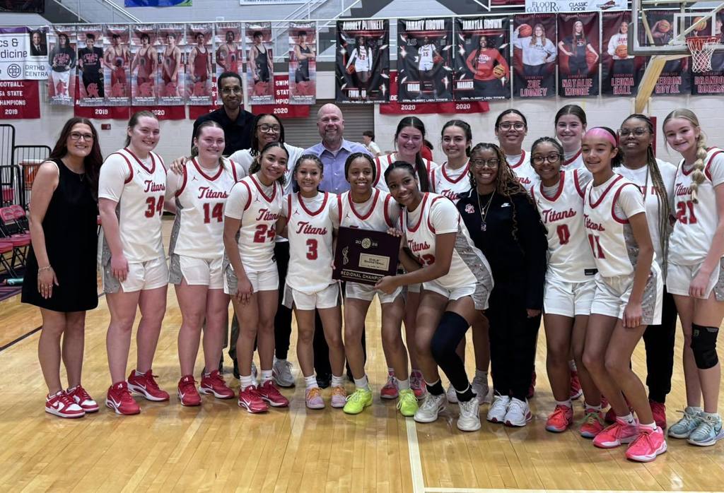 Carl Albert girls won Basketball Regionals. The team is holding the Regional Champiion plaque.