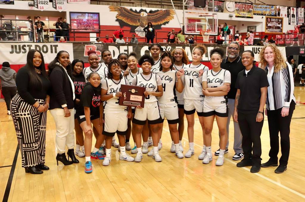 Del City girls won Basketball Regionals. The team is holding the Regional Champiion plaque.