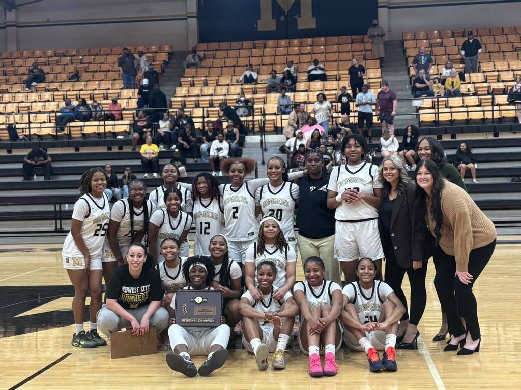 Midwest City girls won Basketball Regionals. The team is holding the Regional Champiion plaque.