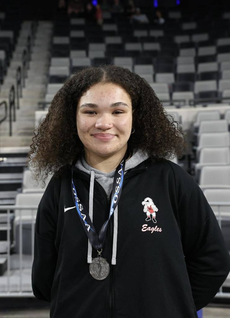 Chloe Daniels is the Class 6A State Runner Up and is wearing her state medal. 