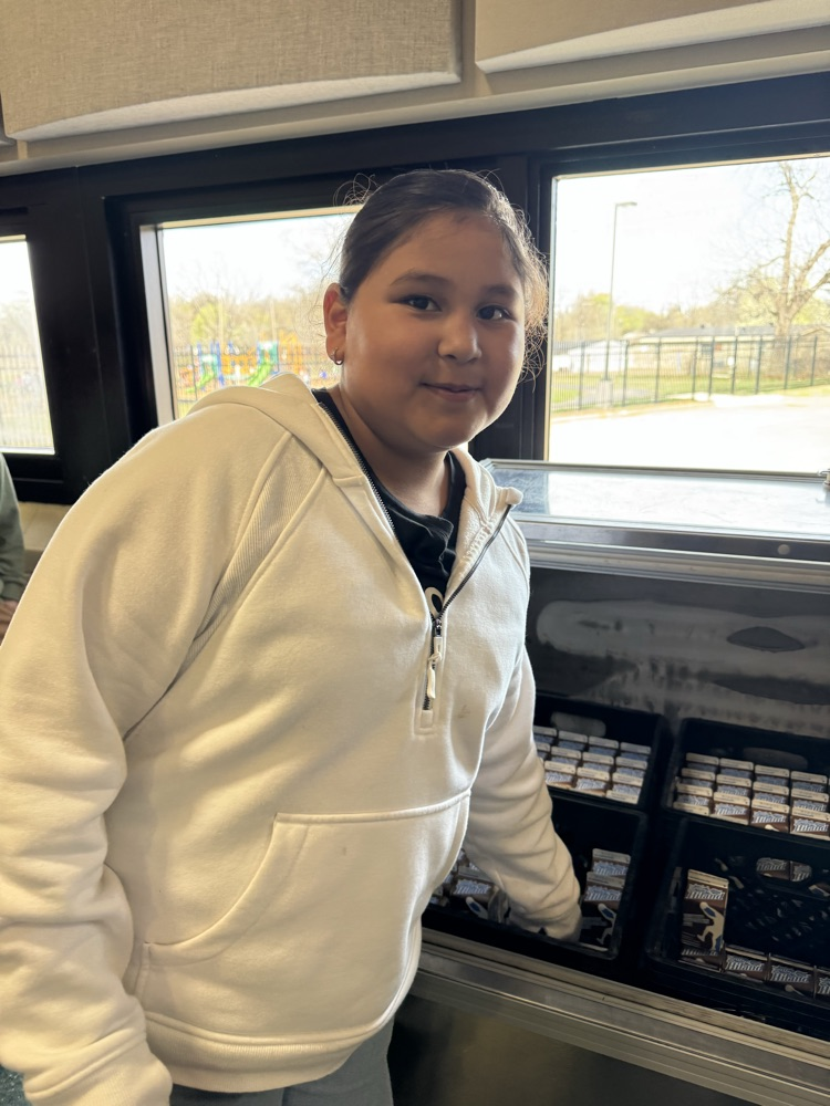 Photos of students in the cafeteria. Enjoying lunch, going through the line to grab a tray, and chatting with friends.