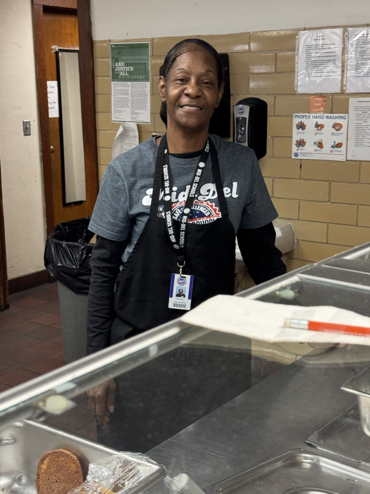Photos of students in the cafeteria. Enjoying lunch, going through the line to grab a tray, and chatting with friends.