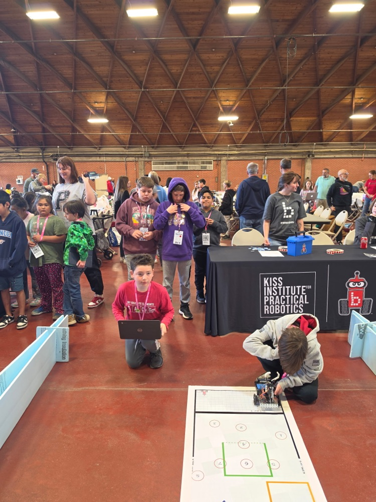  mustang students working on their robot