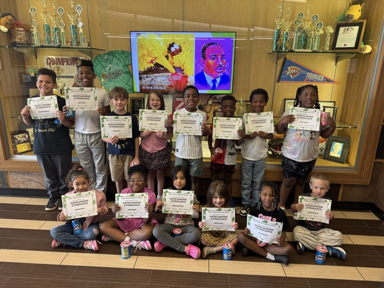 perfect attendance students holding their certificates