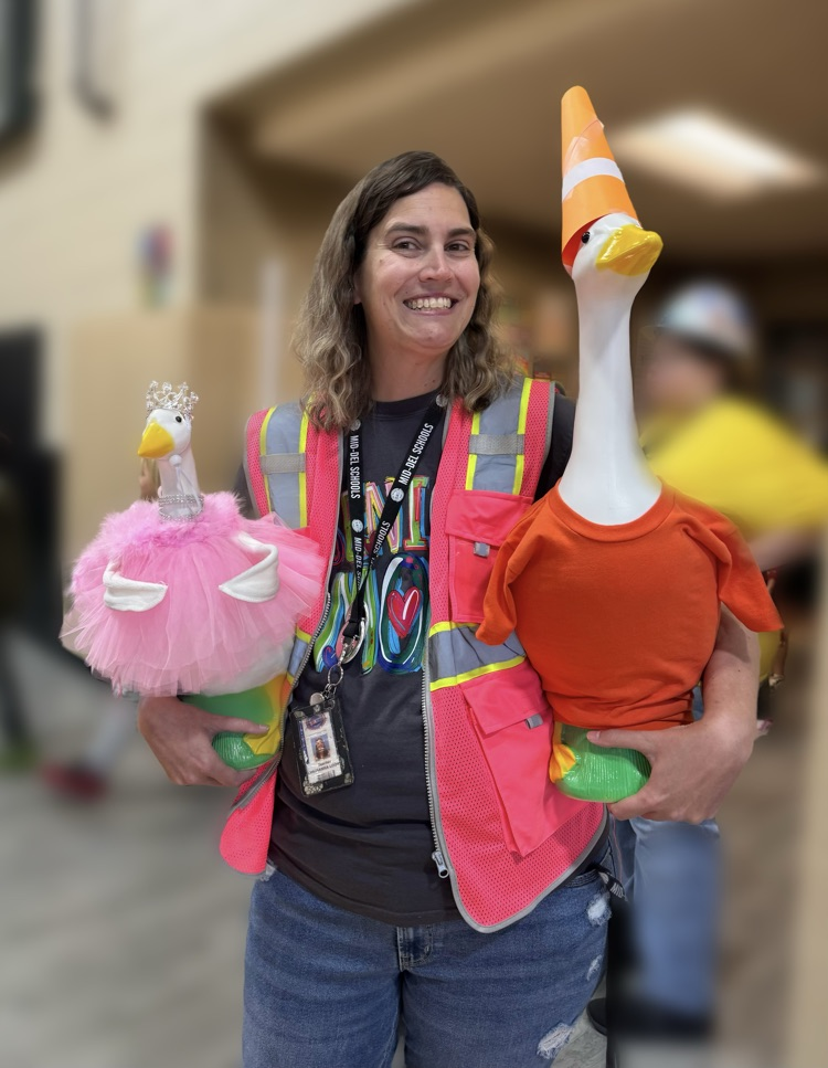 Mrs. Looney, our librarian, holding our school geese