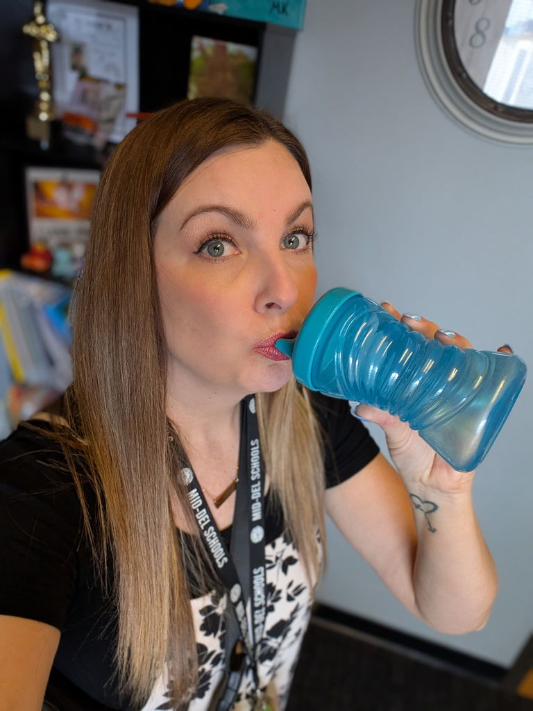 Mrs Paris drinking from a sippy cup.  