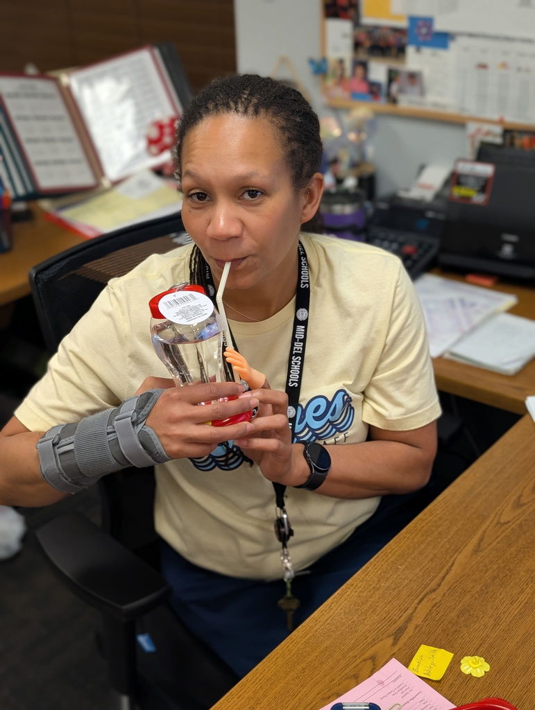 Mrs. Kristen drinking from a hummingbird feeder.  