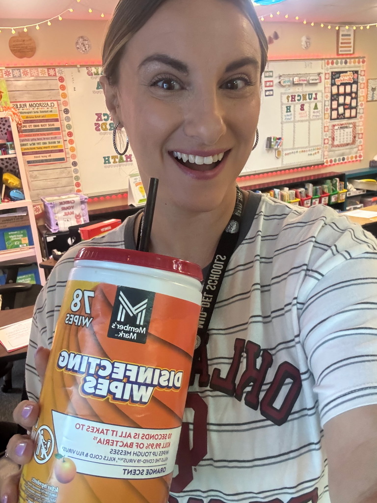 Image of Mrs. Warlick drinking from a wipes container.