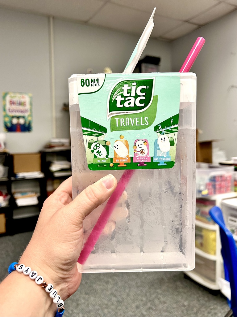 Image of a huge Tic Tac container being used for a drink.  