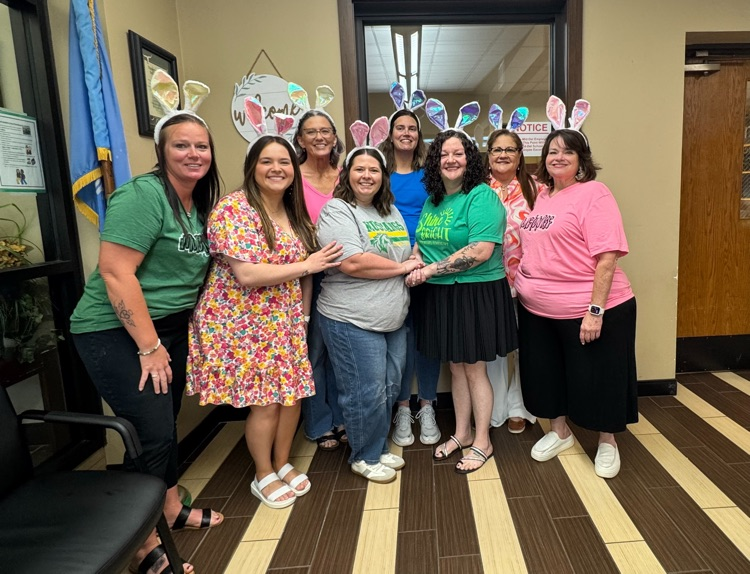 teachers and staff wearing bunny ears