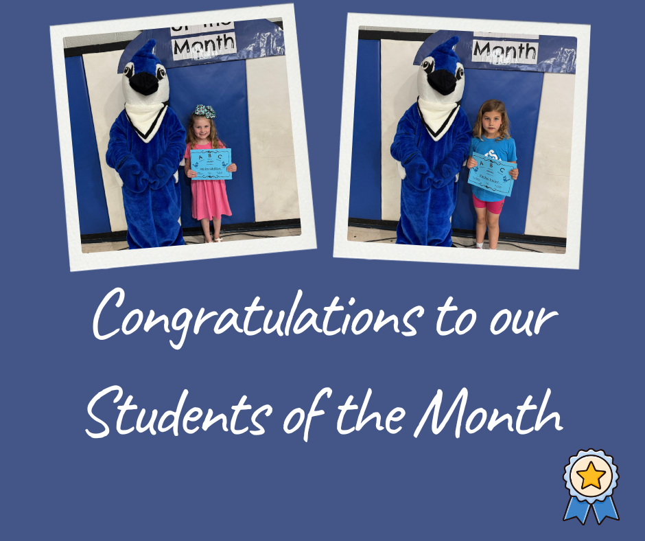 Barnes Elementary Students of the Month stand with the school mascot holding their April award.