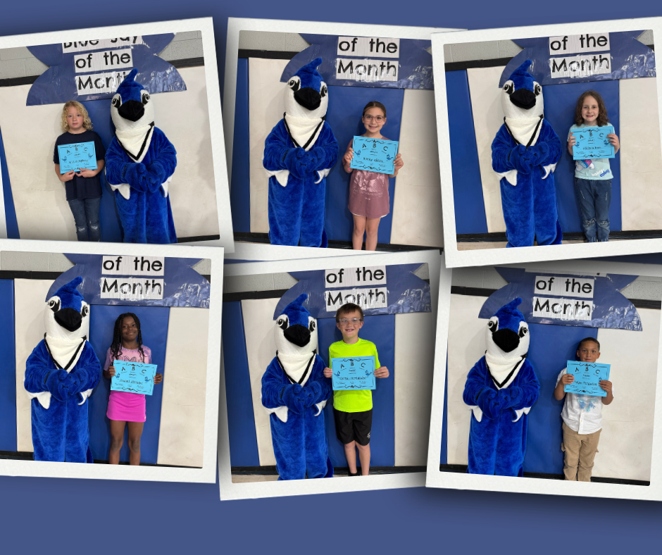 Barnes Elementary Students of the Month stand with the school mascot holding their April award.