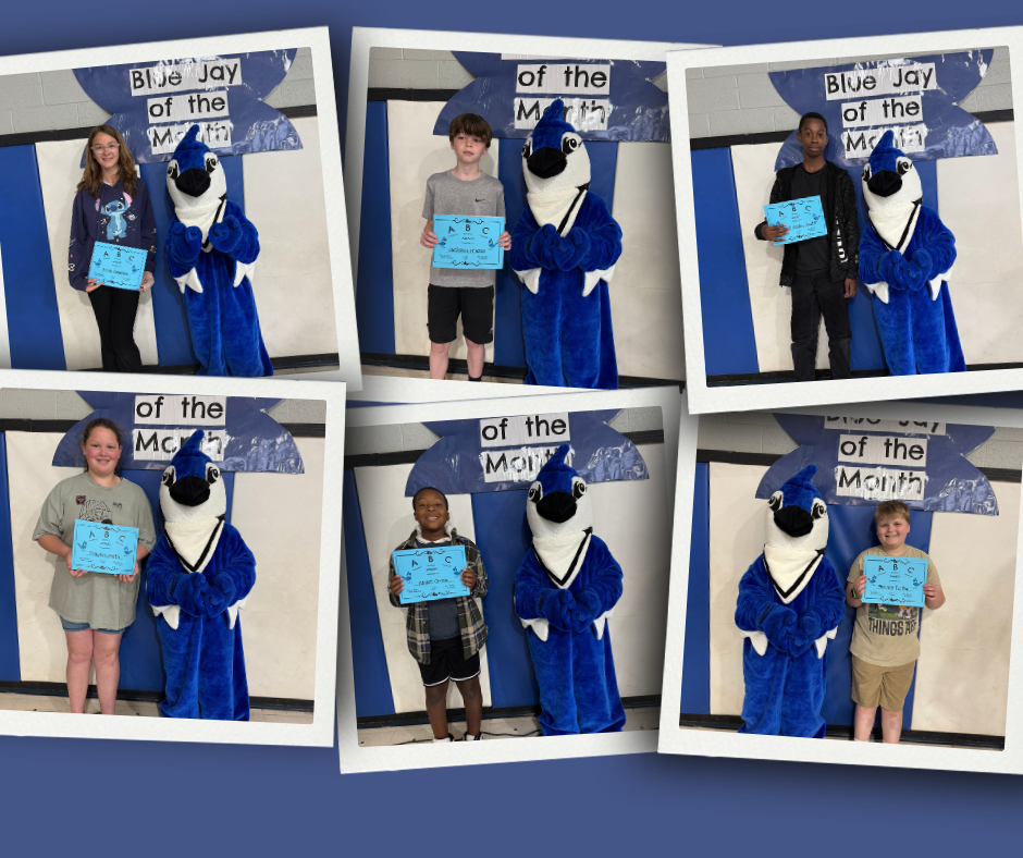 Barnes Elementary Students of the Month stand with the school mascot holding their April award.