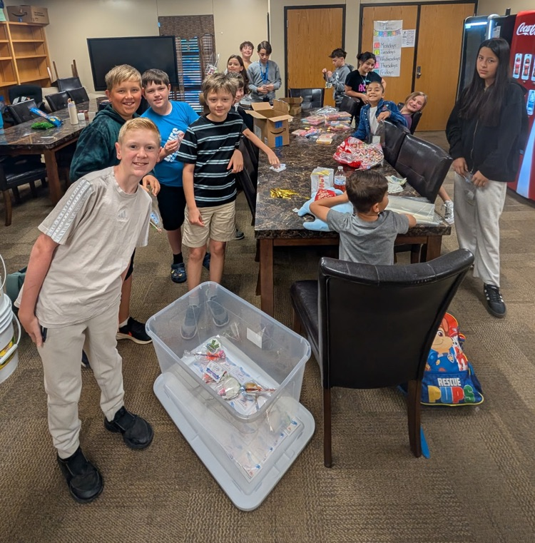 Student council member posing for photo during their final meeting of the school year. 