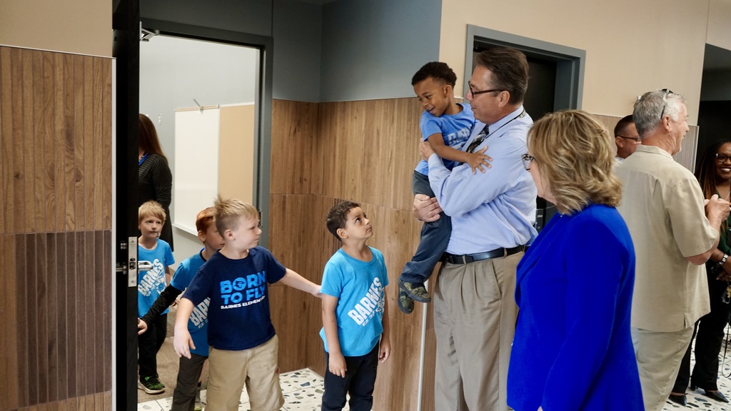 Principal Becker holds a student who needed a hug. 