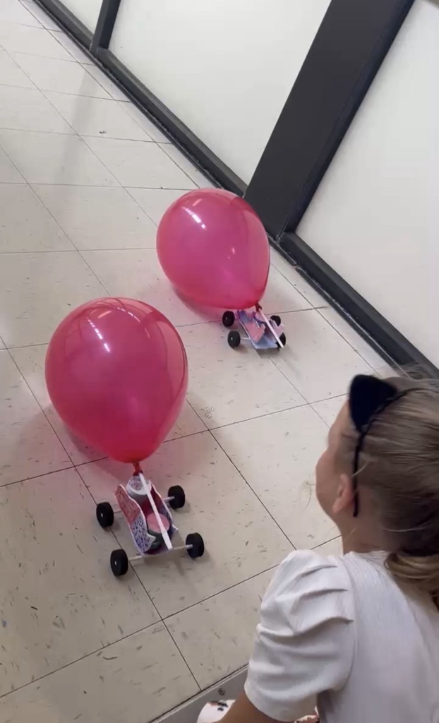 2nd grade students racing self made cars