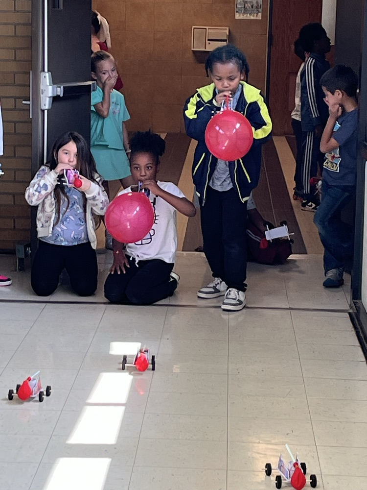 2nd grade students racing self made cars