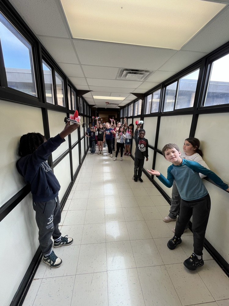 2nd grade students racing self made cars