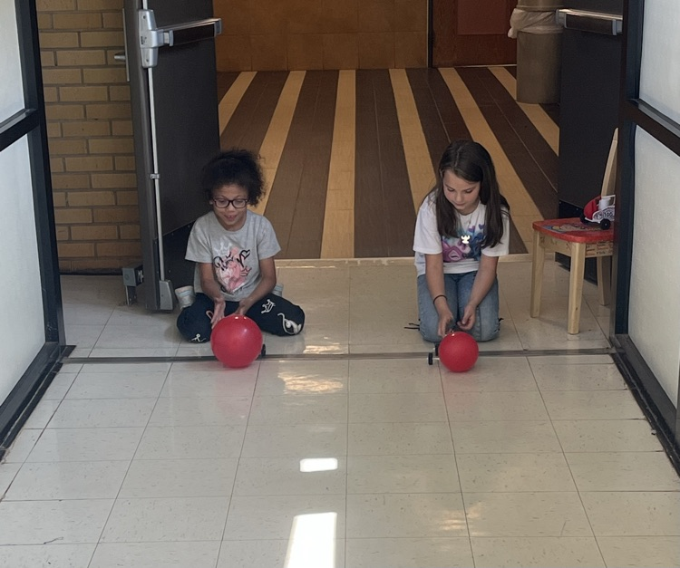 2nd grade students racing self made cars