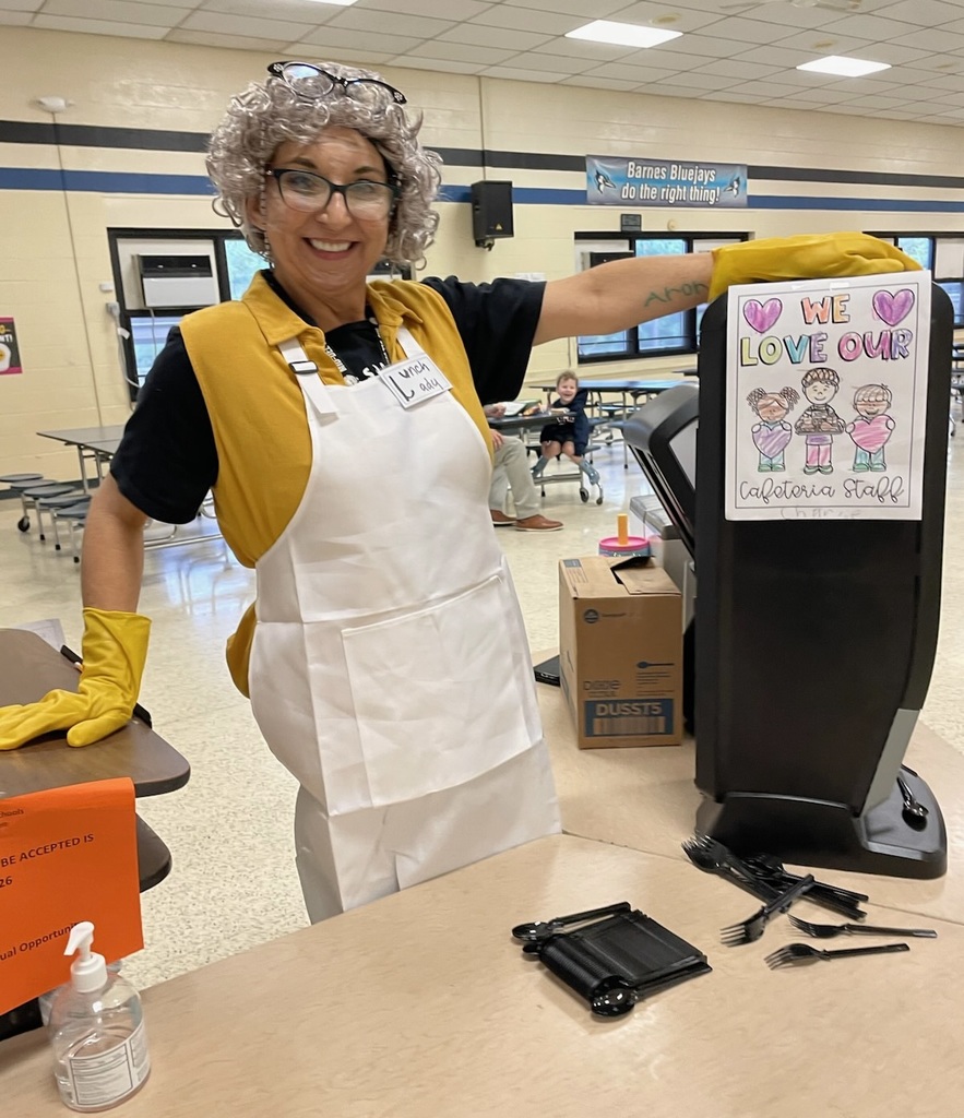 Mrs. Emy dressed up as the Lunch Lady character to surprise kids for a fun day celebrating School Lunch Hero Day.