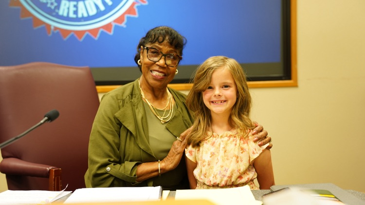 third grader, Olivia, leading the pledge at May 2026 Mid-Del board meeting