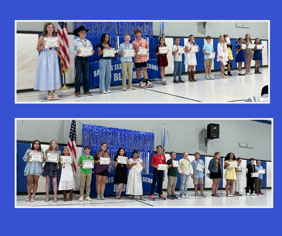 Fifth grade students at Barnes Elementary show their Honor Roll Certificates.  