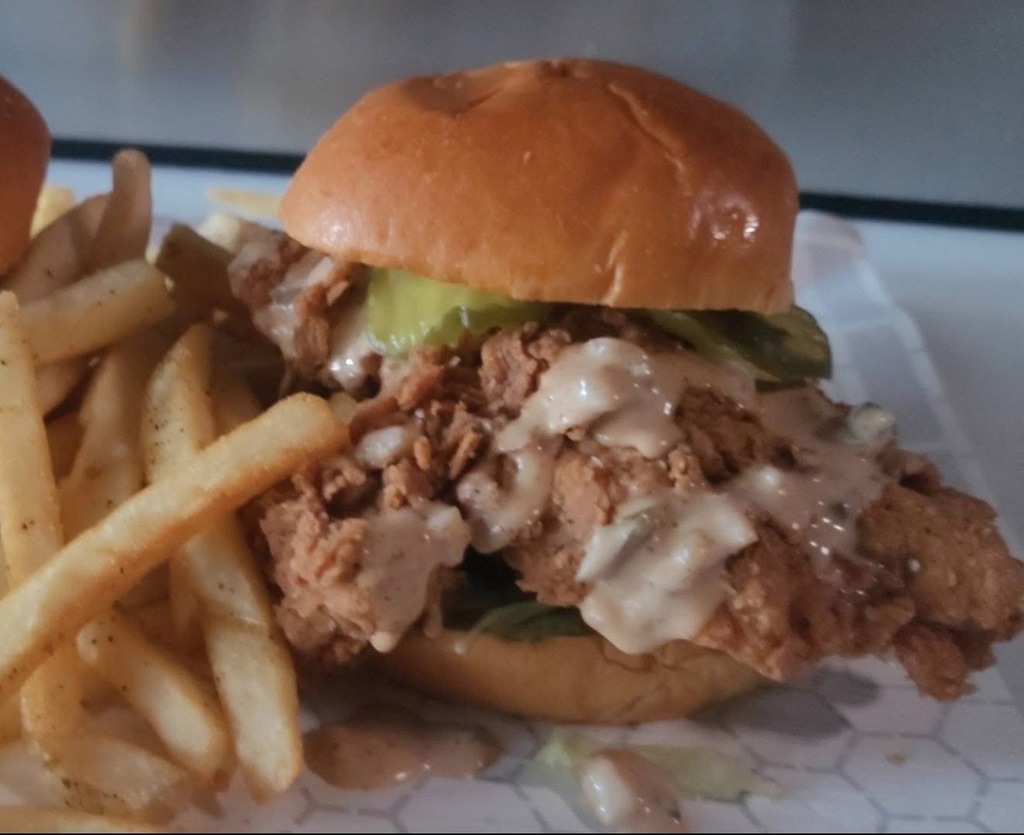 A photo of a chicken strip sandwich and fries from Unknown Unlimited