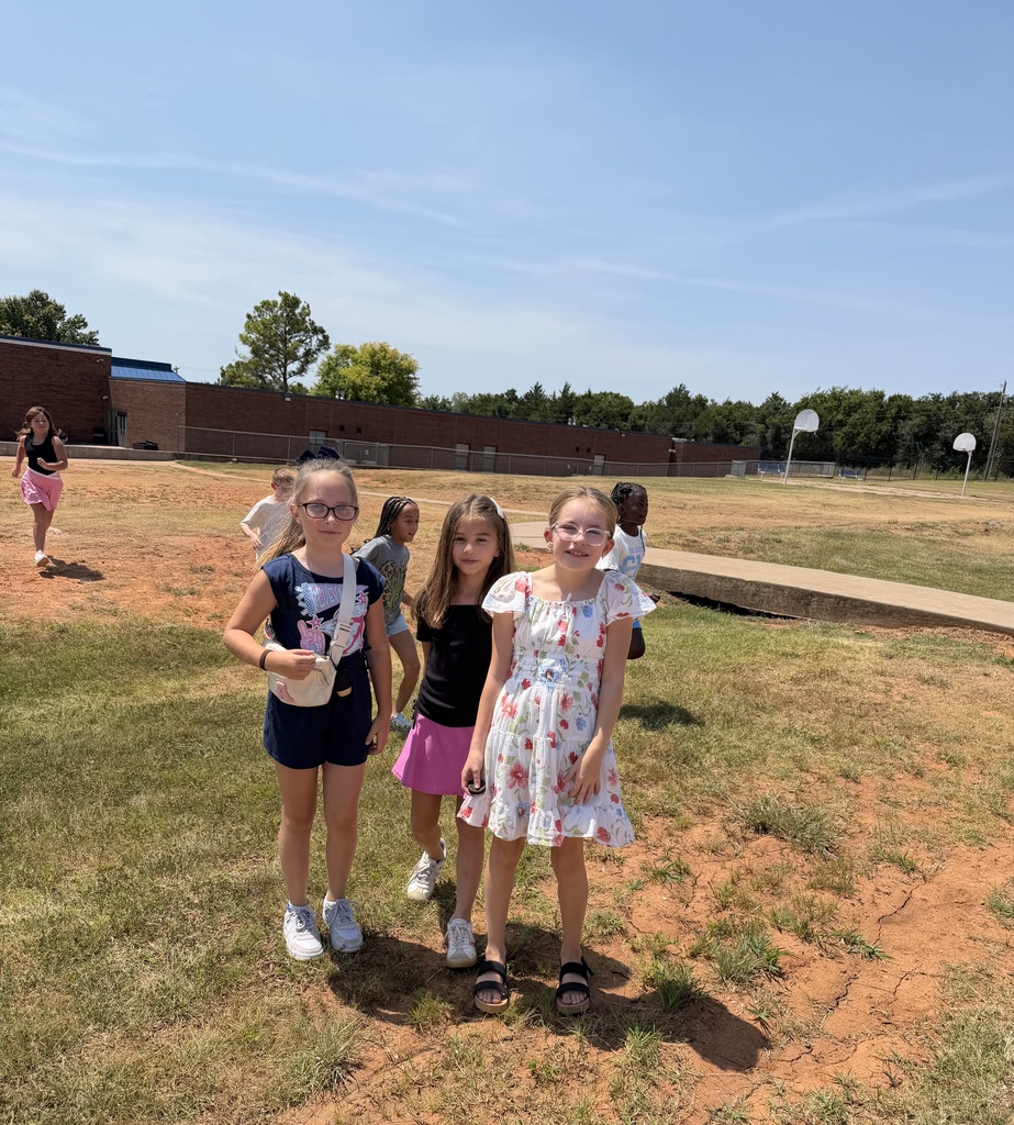Students catch up with their friends at recess.