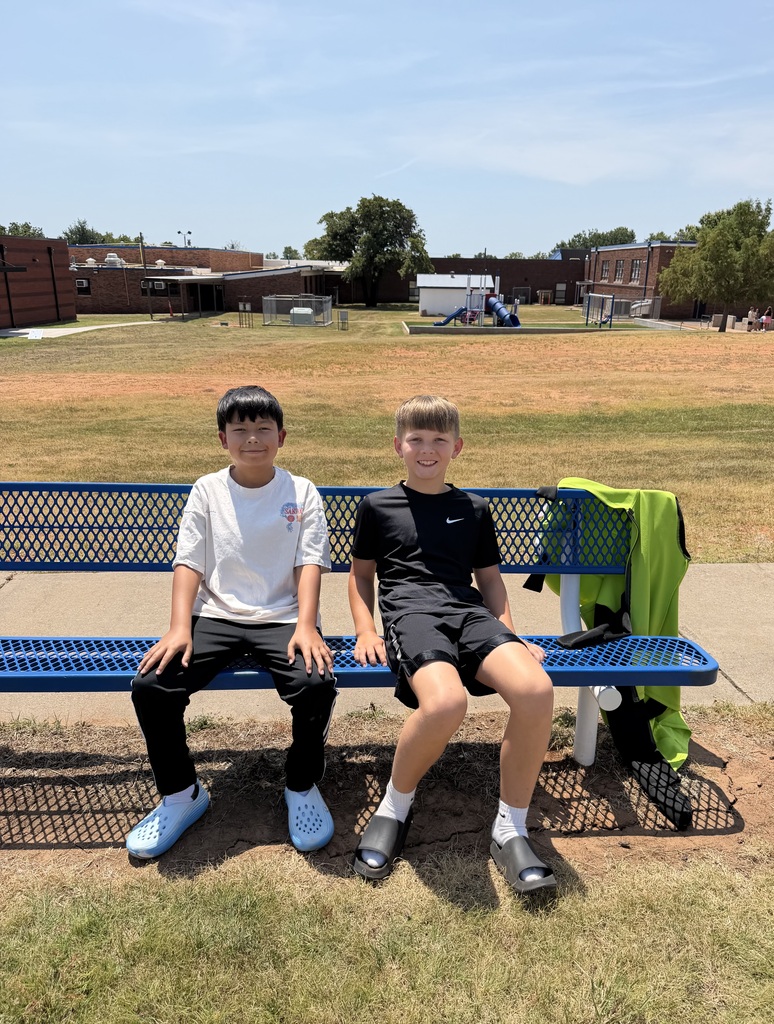 Students catch up with their friends at recess.