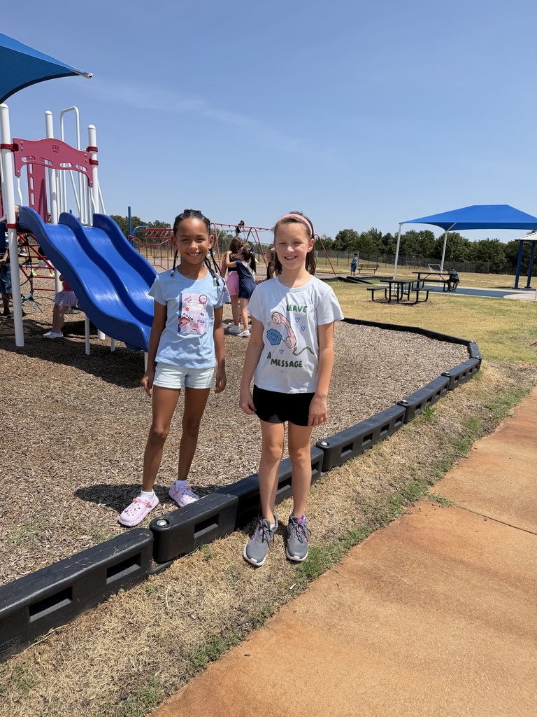 Students catch up with their friends at recess.
