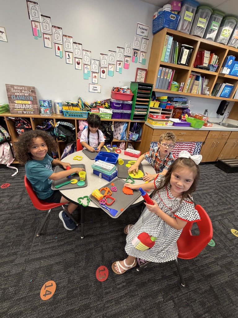 Kindergarten is learning with play dough.