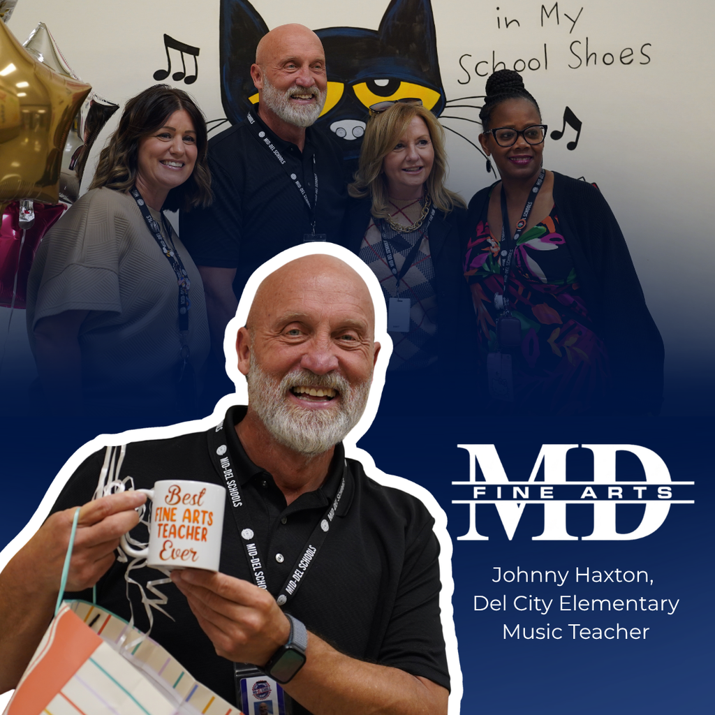 A group of people smile for a photo. A man holds a coffee cup and gift bag. They wear ID lanyards.