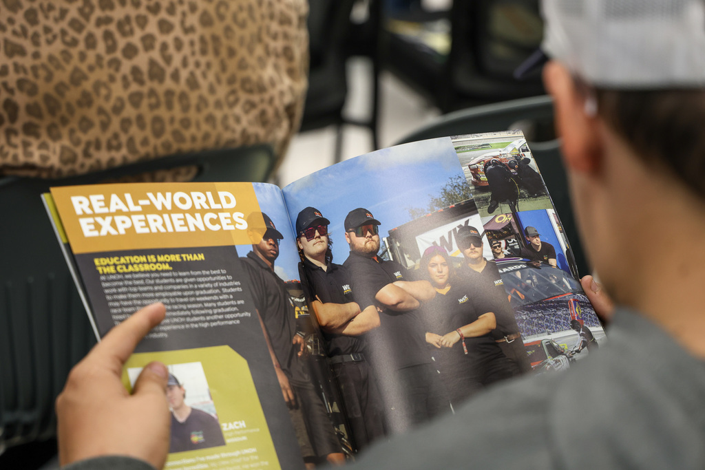 Image of student and UNOH catalog