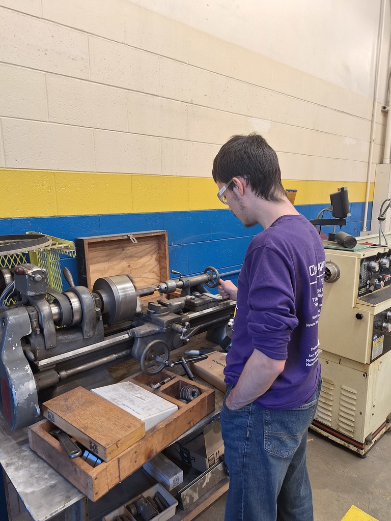 student using lathe