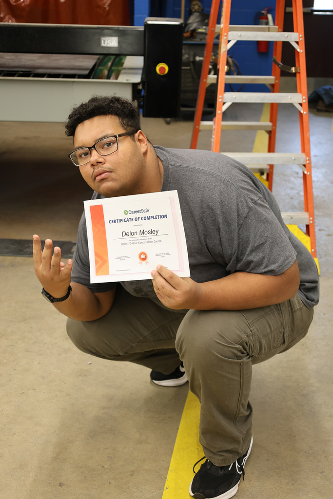 student with certificate