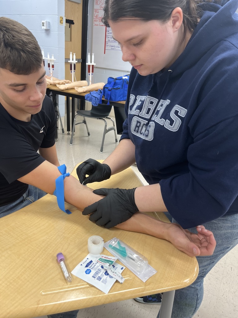 student drawing blood