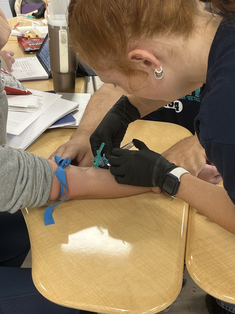 student drawing blood