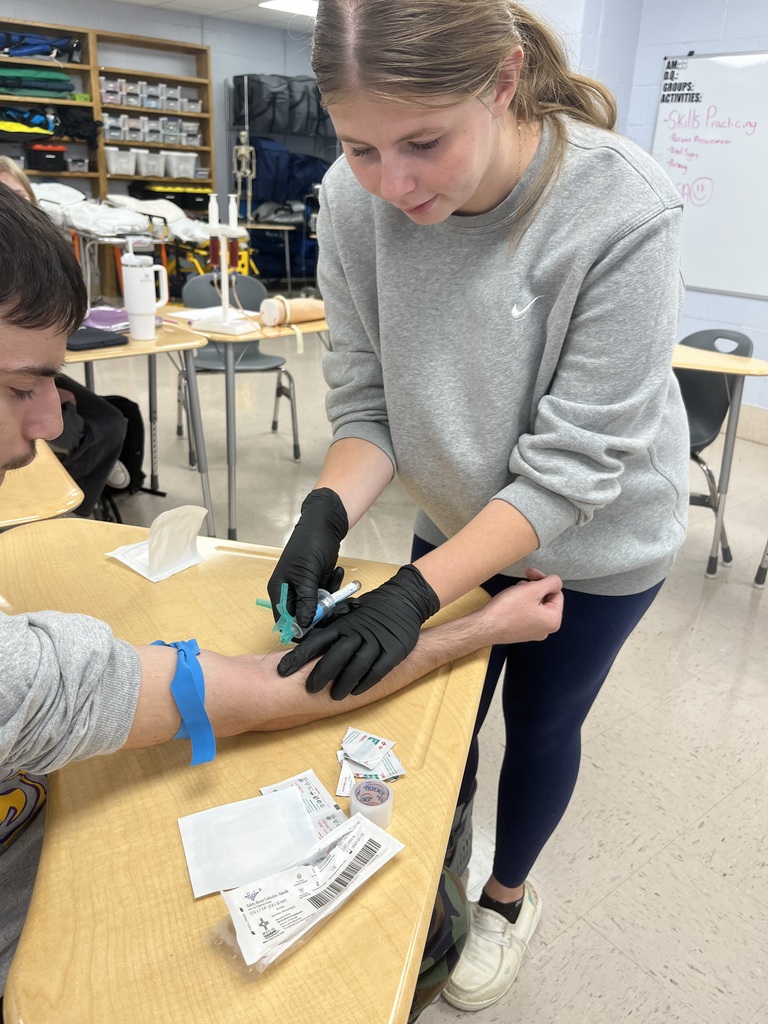 student drawing blood