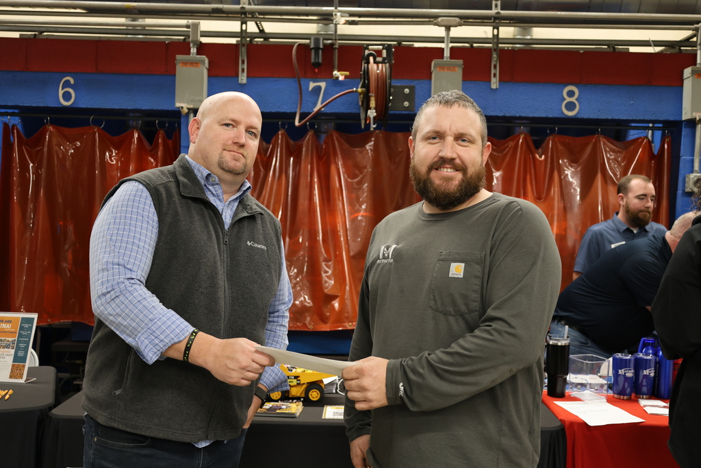 Mr. Mossor receiving check from Boyd Cat