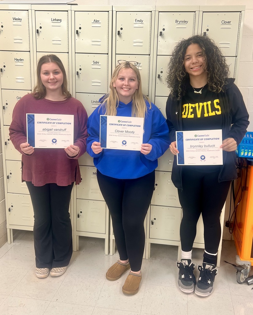 student holding certificate