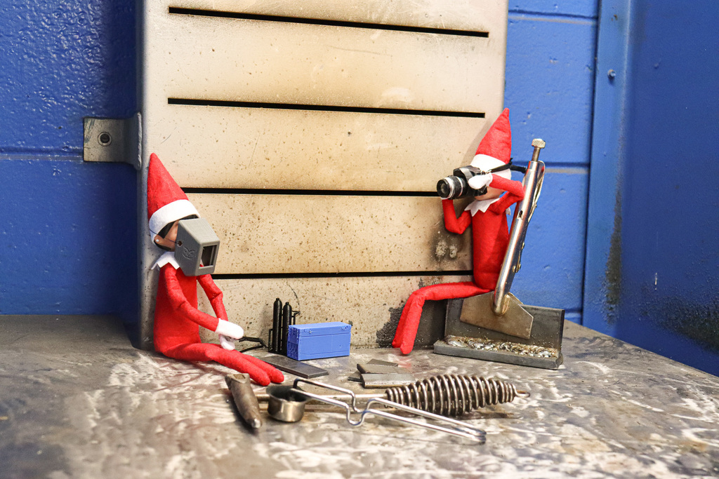 Elves welding in the booth