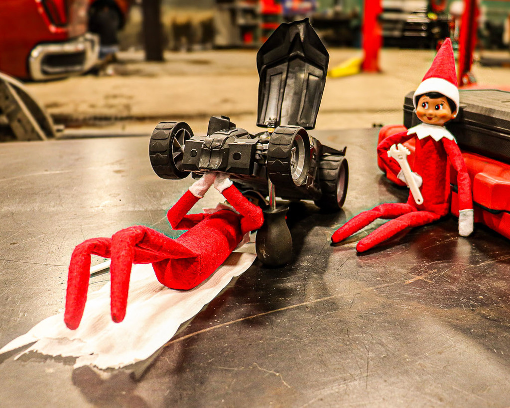 Elves working on Batman's Car