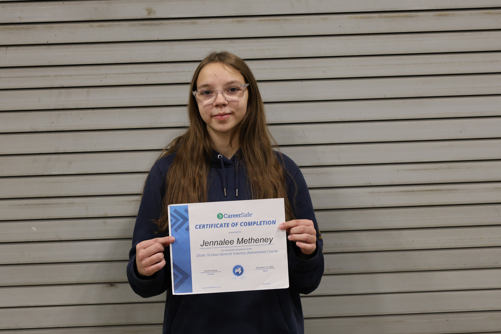 student with certificate